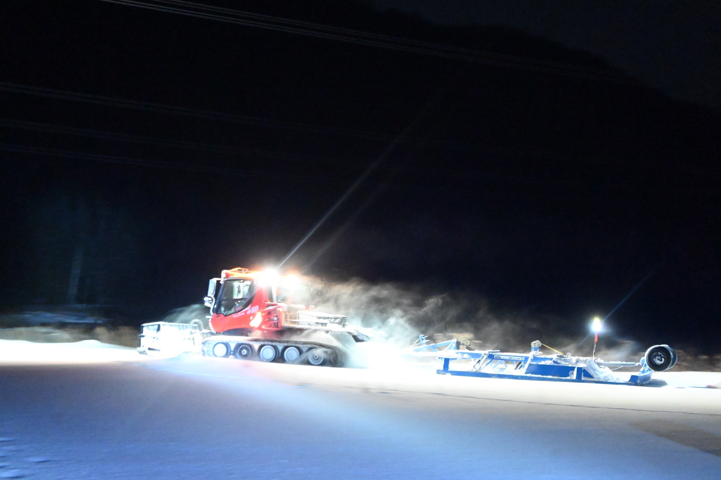 BR trail groomer and drag working in the snow