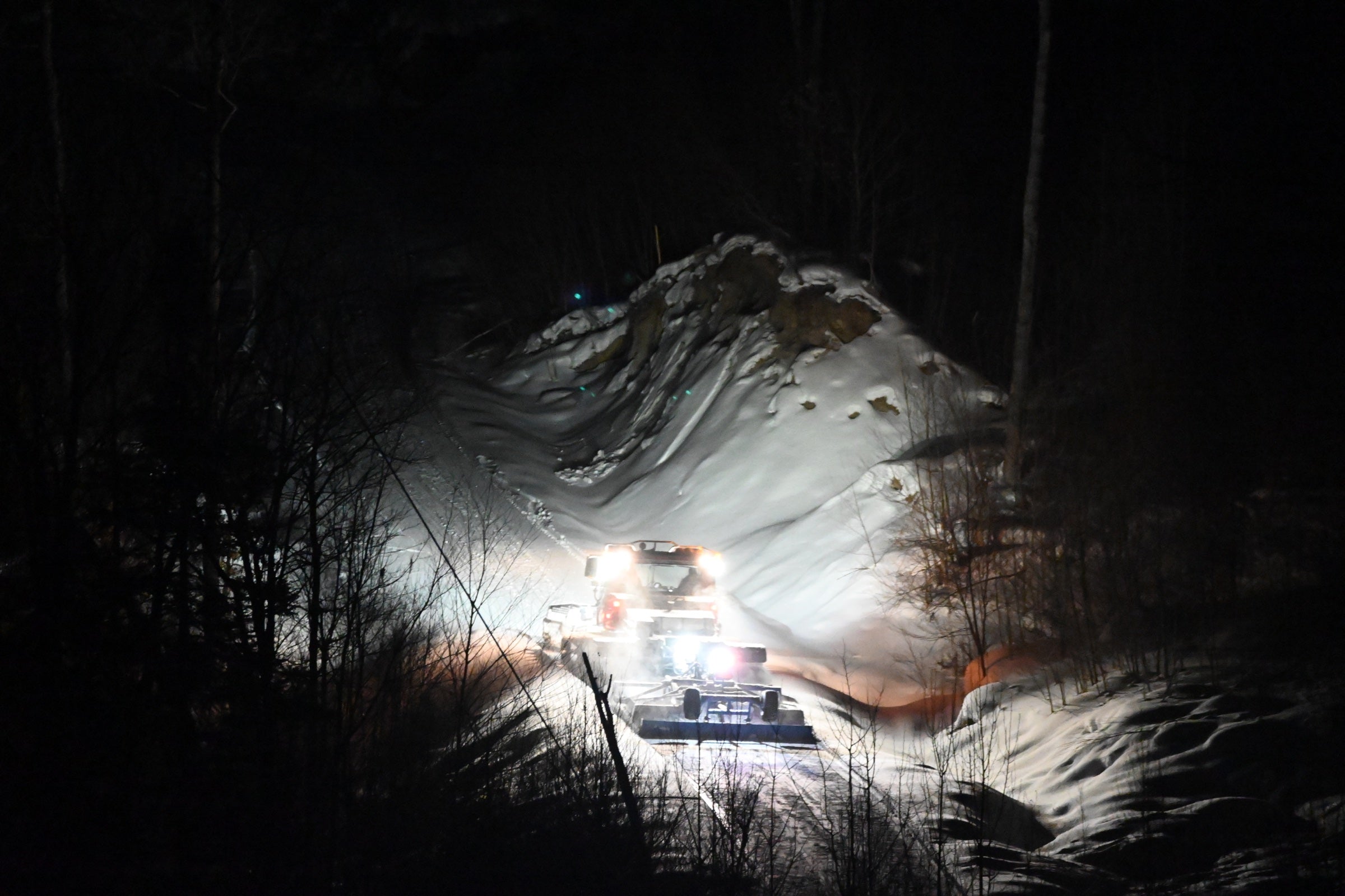 BR trail groomer climbing a steep trail during maintenance