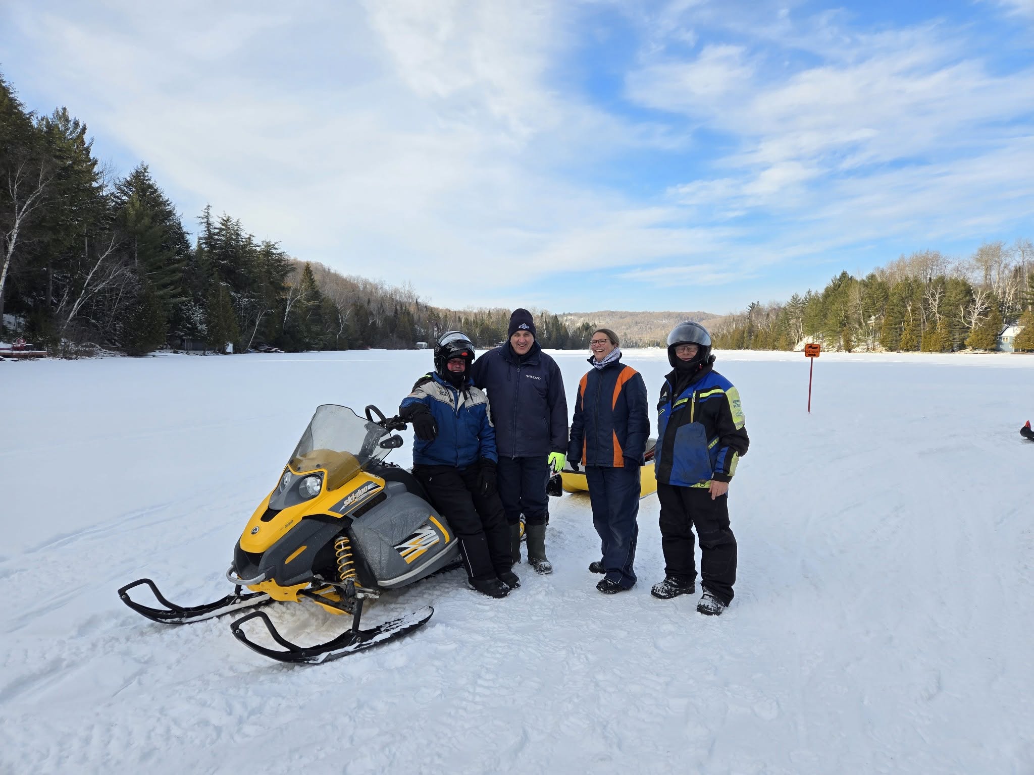 Club snowmobilers gathered during a break
