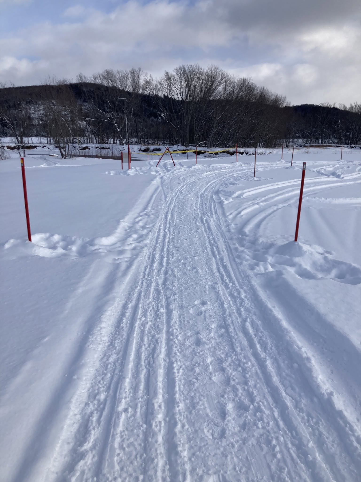 Freshly groomed snowmobile trail in the forest